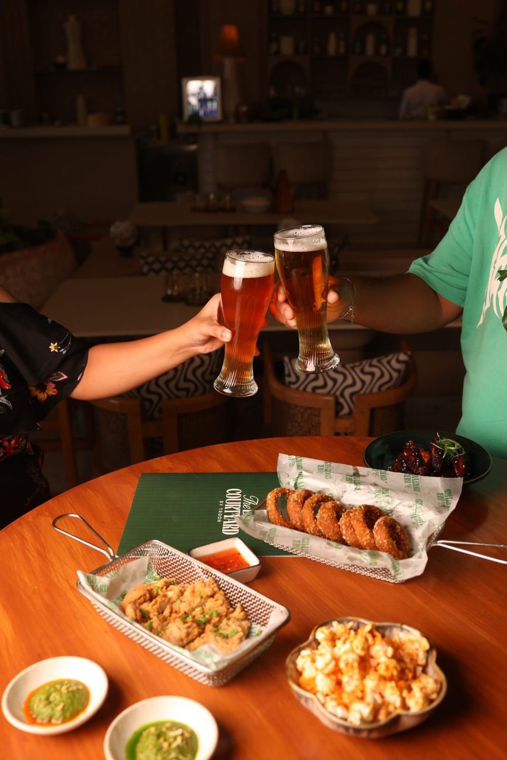Cheers with craft beer at a courtyard table, Kalyani Nagar