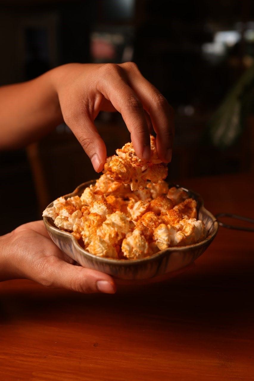 Sharing a bowl of popcorn at TBC pub in Pune